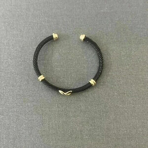 Black enamel bracelet with gold detail
